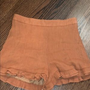 Style rack burnt orange shorts
